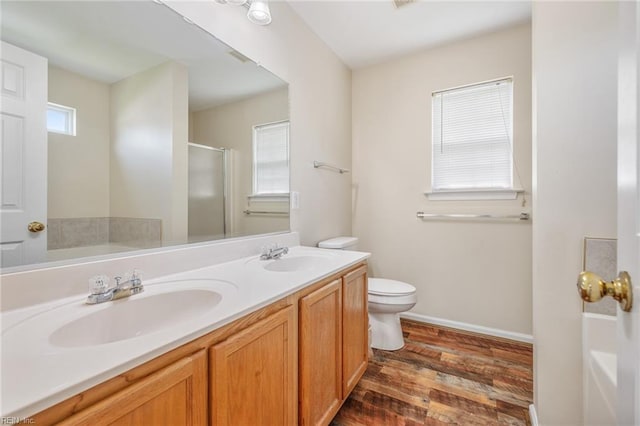 full bath with a sink and a wealth of natural light