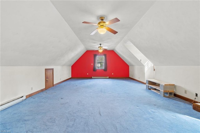 additional living space featuring a baseboard heating unit, lofted ceiling, baseboards, and carpet floors