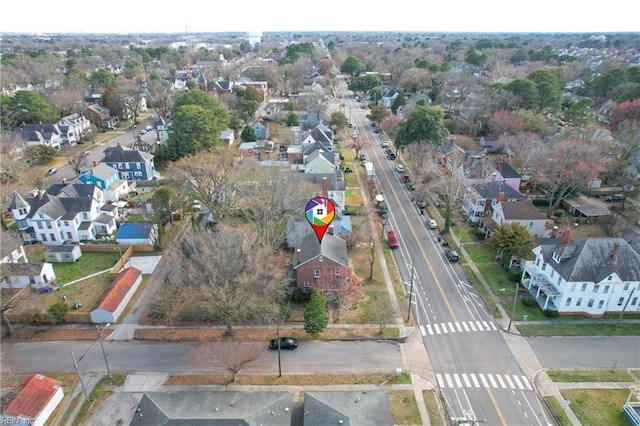 birds eye view of property with a residential view