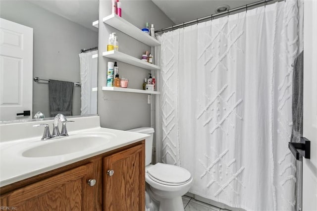 bathroom with toilet and vanity