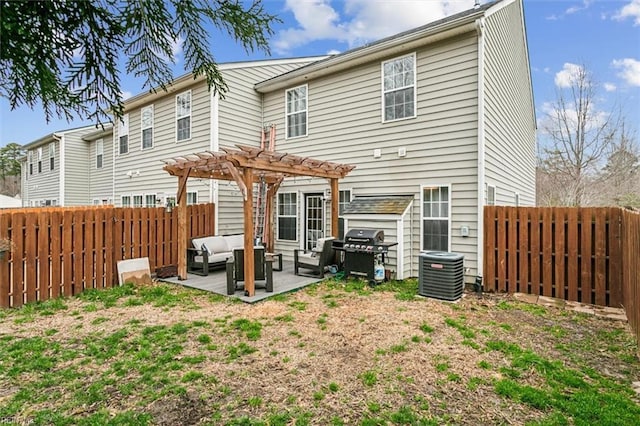 rear view of property with outdoor lounge area, a patio area, a pergola, and a fenced backyard