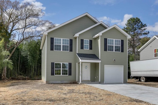 traditional home with driveway, a garage, and roof with shingles