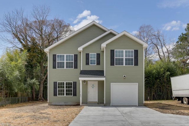 traditional-style home with an attached garage, fence, concrete driveway, and roof with shingles