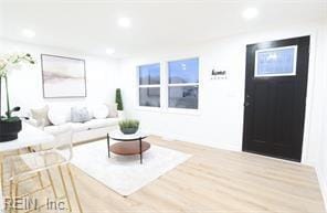 living room featuring recessed lighting and wood finished floors