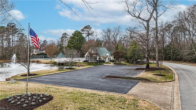 view of home's community featuring uncovered parking