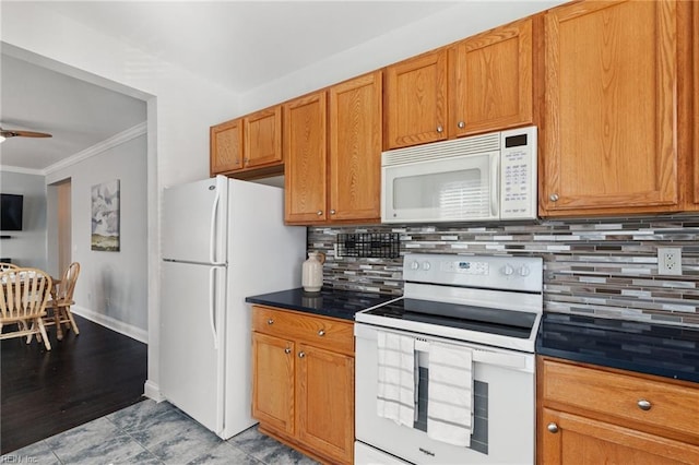 kitchen featuring white appliances, decorative backsplash, dark countertops, ceiling fan, and crown molding