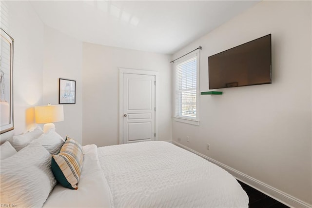 bedroom featuring baseboards