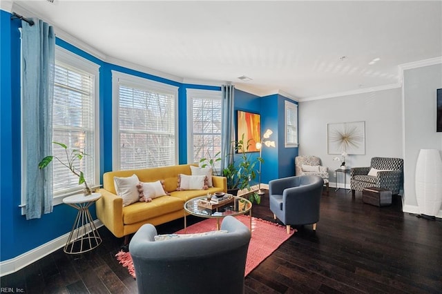 living area featuring baseboards, crown molding, and hardwood / wood-style floors