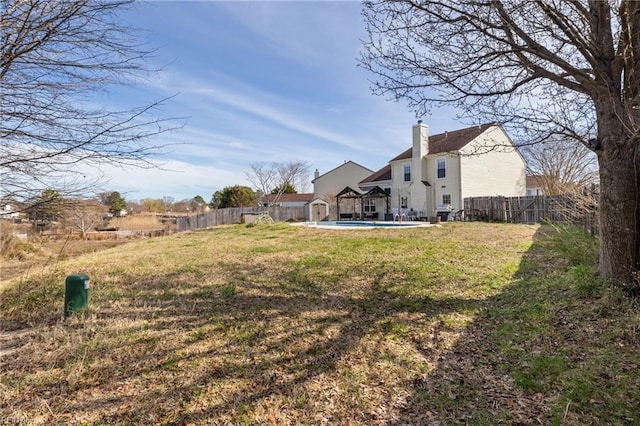 view of yard with a fenced in pool and a fenced backyard