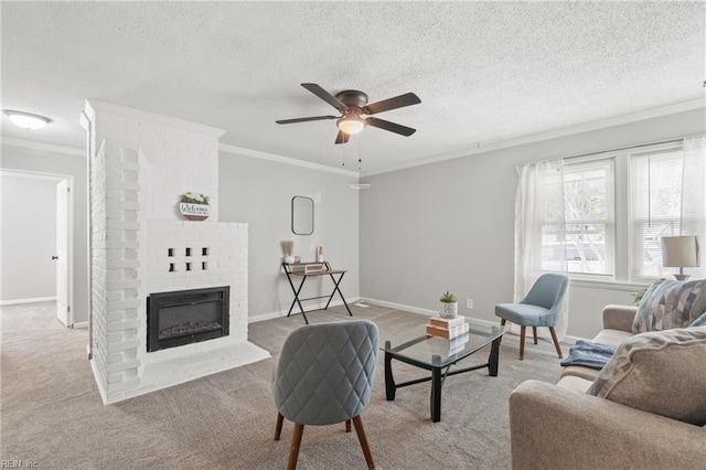 carpeted living area with crown molding, a brick fireplace, ceiling fan, a textured ceiling, and baseboards