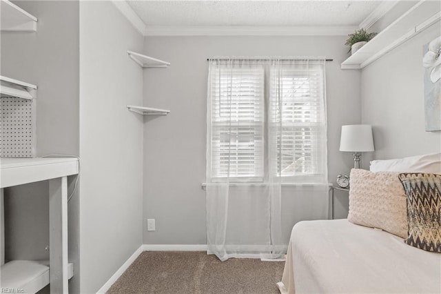 carpeted bedroom with baseboards, a textured ceiling, and crown molding