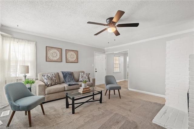 carpeted living area with crown molding, plenty of natural light, a textured ceiling, and baseboards