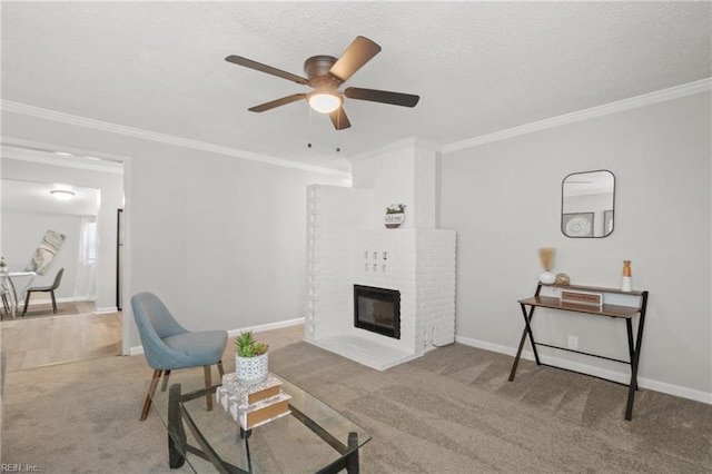 carpeted living room featuring ornamental molding, a fireplace, a textured ceiling, and baseboards