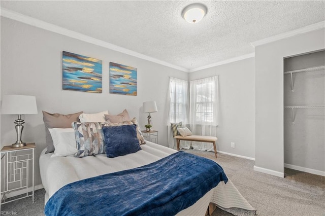 bedroom featuring a textured ceiling, carpet floors, baseboards, ornamental molding, and a closet