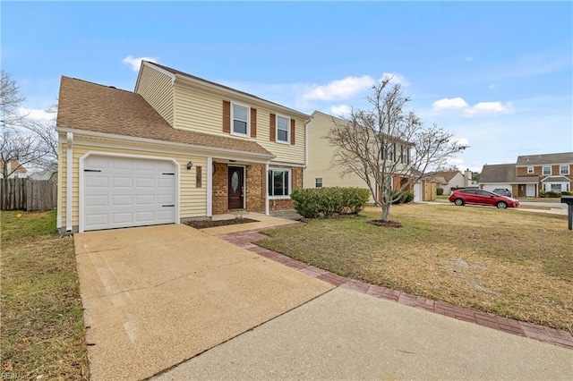 traditional home with a garage, brick siding, fence, concrete driveway, and a front yard