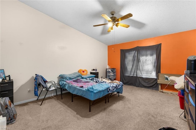 bedroom with lofted ceiling, carpet, a ceiling fan, and baseboards