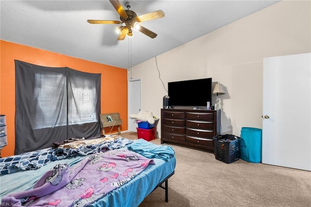 bedroom featuring vaulted ceiling, carpet, and a ceiling fan