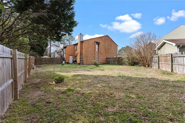 view of yard featuring a fenced backyard