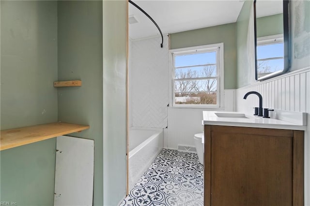 bathroom with tile patterned flooring, visible vents, vanity, and toilet