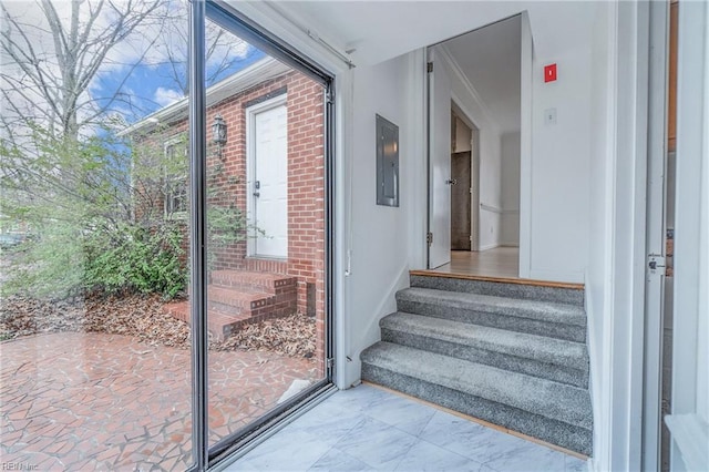 doorway to outside featuring electric panel