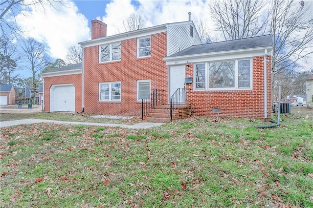 view of front of home with a chimney, an attached garage, crawl space, a front lawn, and brick siding