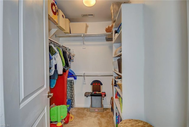 spacious closet with visible vents and carpet flooring