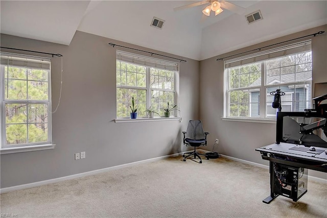 office featuring vaulted ceiling, carpet flooring, visible vents, and baseboards