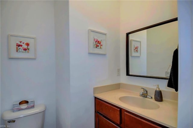 half bath with vanity and toilet