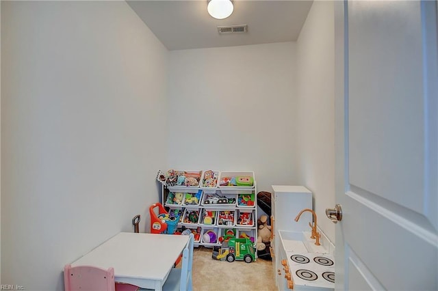 playroom with carpet and visible vents