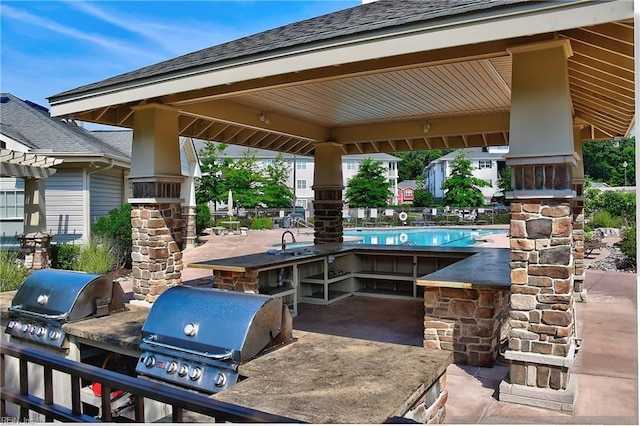 view of patio / terrace with area for grilling, grilling area, and a sink