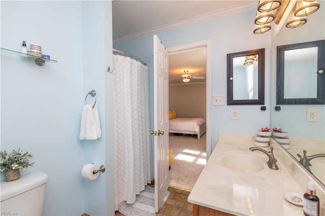 bathroom featuring crown molding, vanity, and toilet