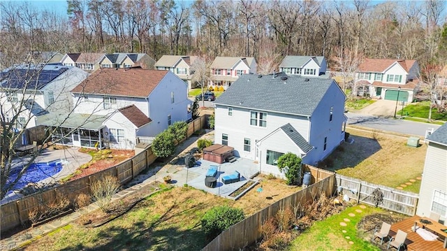 birds eye view of property with a residential view