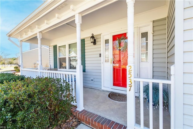 property entrance featuring a porch