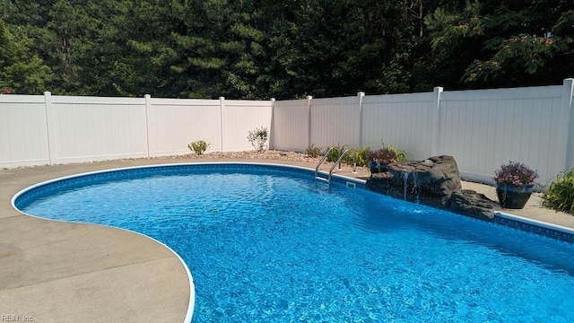 view of pool featuring a fenced backyard and a fenced in pool