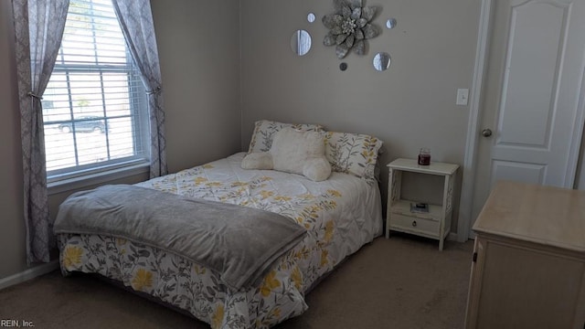 bedroom featuring light colored carpet