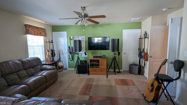 living room featuring ceiling fan, carpet floors, visible vents, and baseboards