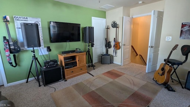 carpeted living area with visible vents and baseboards