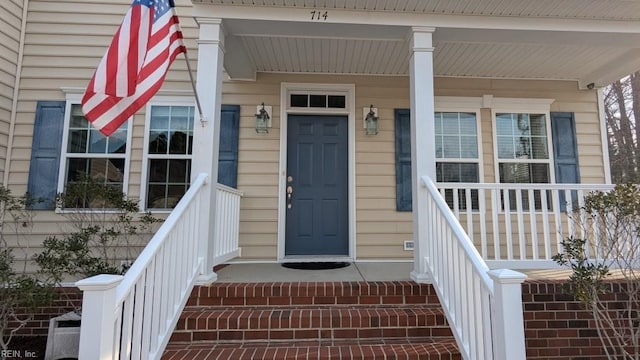 doorway to property featuring a porch