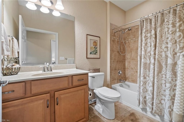 full bath with shower / bath combo, a textured wall, toilet, tile patterned flooring, and vanity