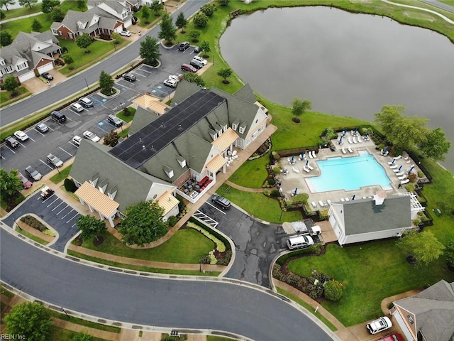 birds eye view of property featuring a water view and a residential view