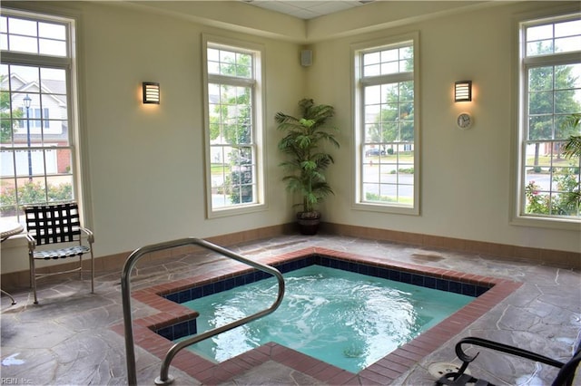 view of swimming pool with an indoor in ground hot tub