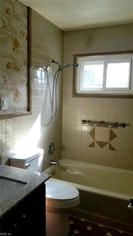 bathroom featuring shower / bath combination, vanity, and toilet