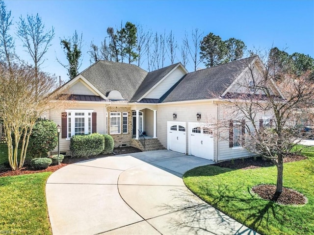 view of front facade featuring a front yard, roof with shingles, driveway, crawl space, and an attached garage