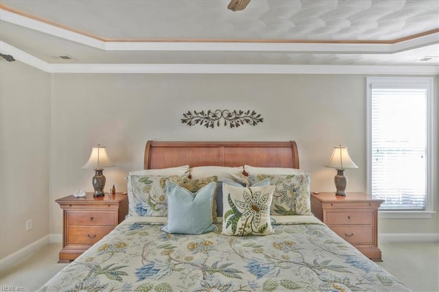 bedroom featuring visible vents, crown molding, baseboards, light carpet, and a raised ceiling