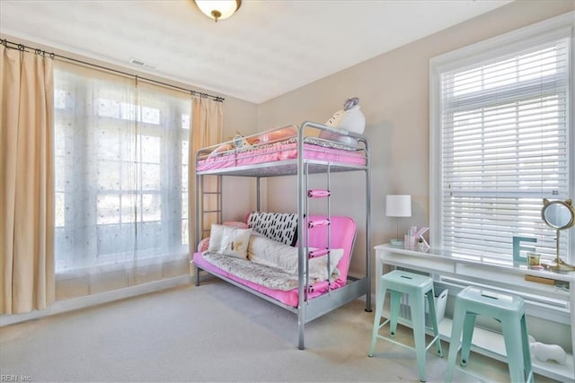 bedroom featuring visible vents and carpet flooring