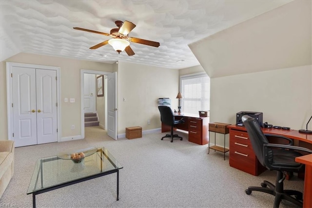 office featuring a textured ceiling, baseboards, ceiling fan, and carpet floors