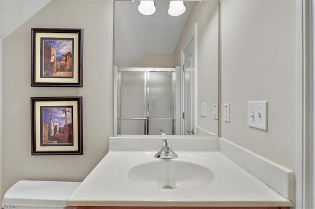 full bathroom with a shower stall and vanity