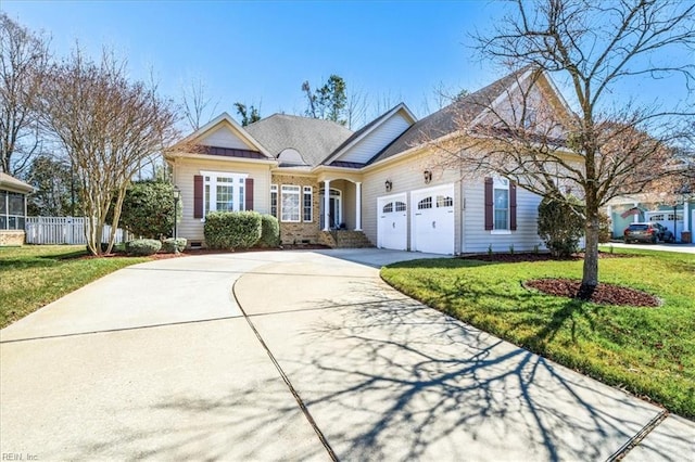 view of front facade featuring a garage, concrete driveway, a front yard, and fence