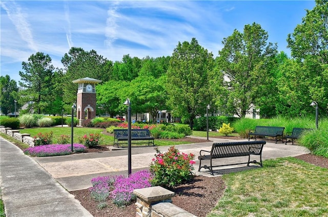 view of property's community with a lawn