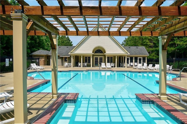 pool featuring a patio, a pergola, and fence